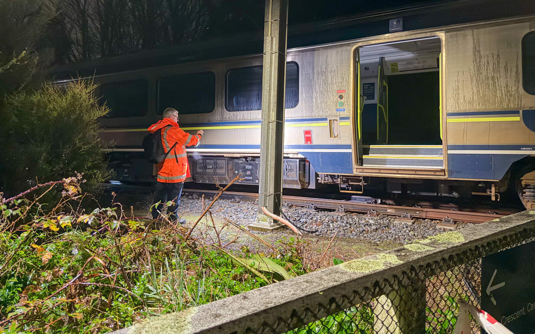 Investigators at the scene of a train that derailed between Box Hill and Khandallah stations in Wellington.