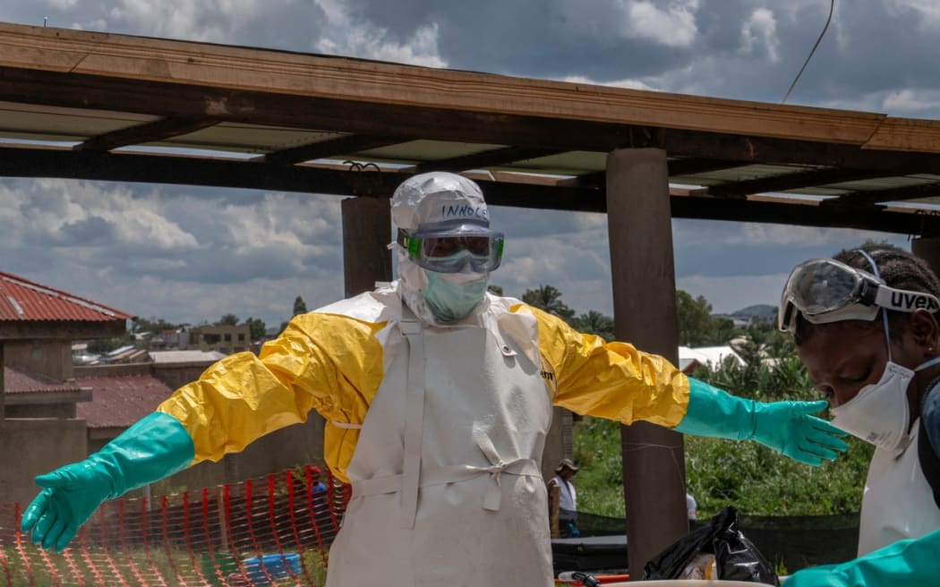A Doctors Without Borders medic at the Elikya clinic Ebola treatment center is sprayed with chemicals after leaving the hospital rooms for Ebola patients in Bunia, in the Democratic Republic of the Congo, on 5 June, 2026.