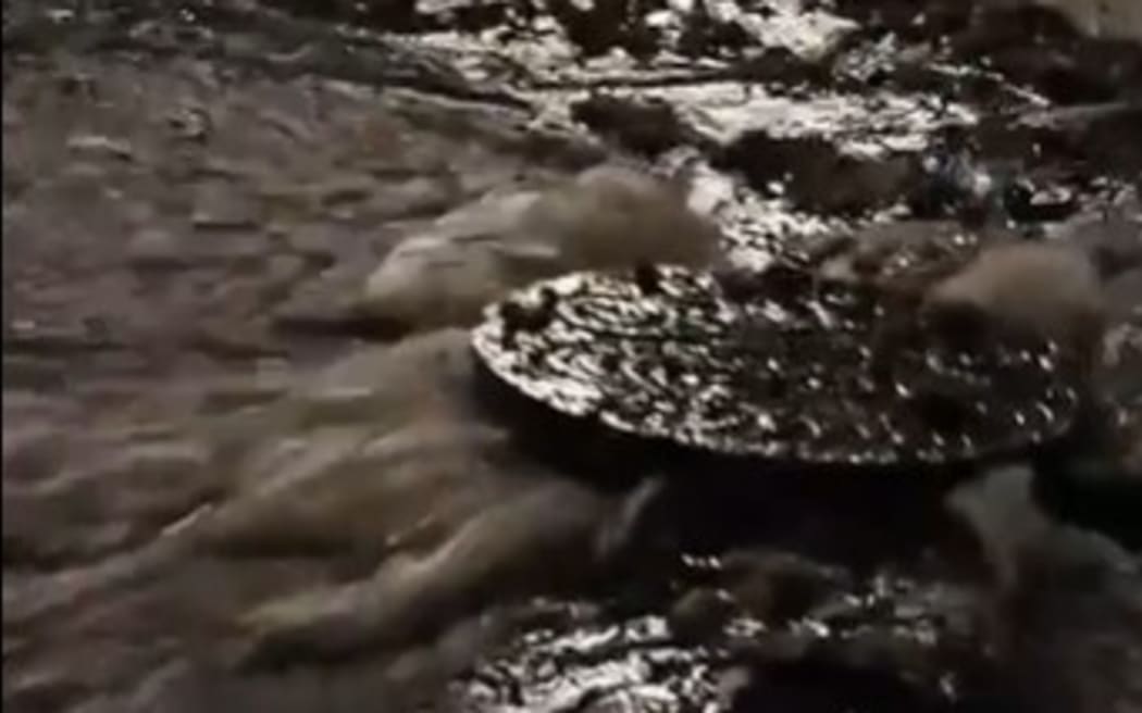 Residents in Wellington's Island Bay say they were disgusted to find a stream of faecal matter and sanitary products from overflowing maintenance hole covers during heavy rain overnight.