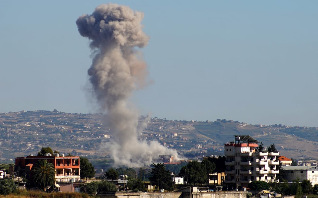 A photograph taken from the southern area of Nabatieh shows smoke rising from the site of an israeli airstrike in the village of Zawtar al-Sharkiyeh on June 4, 2026. The Lebanese president said June 4, that an agreement on implementing a ceasefire announced in Washington after talks with Israel was the