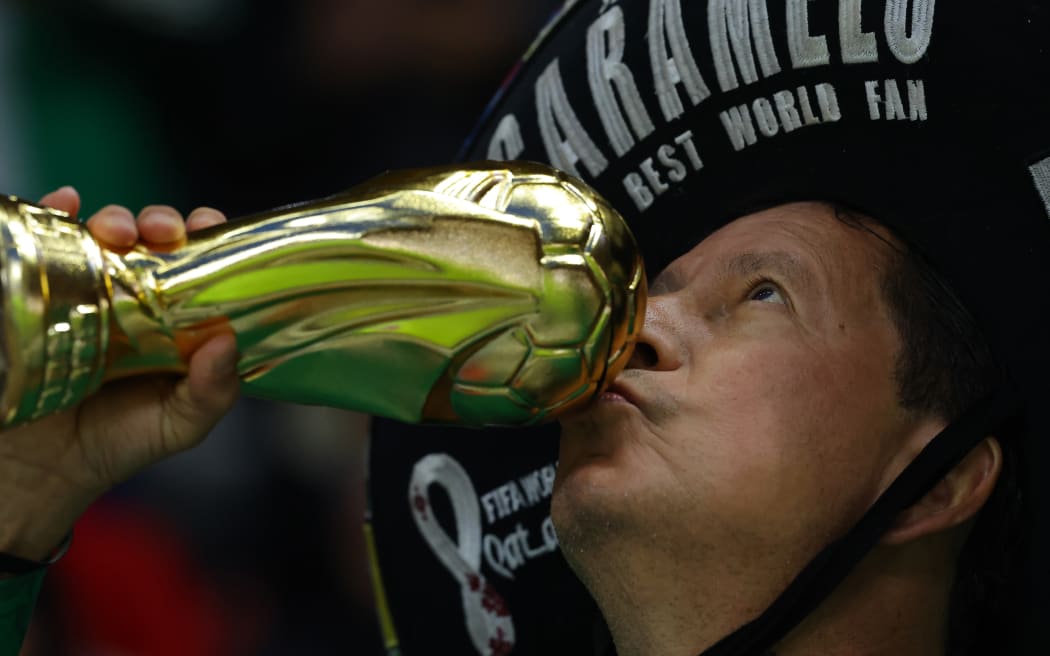 Super fan Caramelo, self titled Fifa Best World fan kisses a plastic FIFA World Cup prior to the international friendly match between Mexico and Serbia at Nemesio Diez Stadium on June 04, 2026 in Toluca, Mexico. (Photo by Agustin Cuevas/Getty Images)