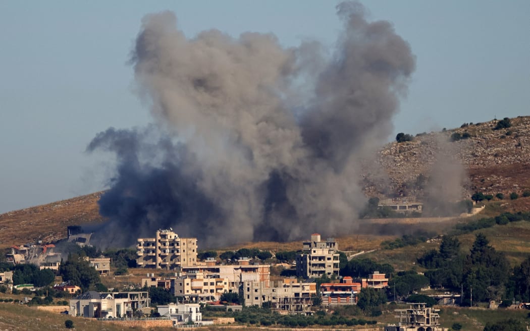 This photograph taken from the southern Lebanese area of Marjayoun shows smoke rising from the site of an Israeli strike that targeted the village of Kfar Tibnit on June 3, 2026. Lebanon's army said two personnel were wounded when an Israeli strike hit a military vehicle in the country's south on June 3, as Israel pounds the region in its ongoing war against Hezbollah. (Photo by AFP)