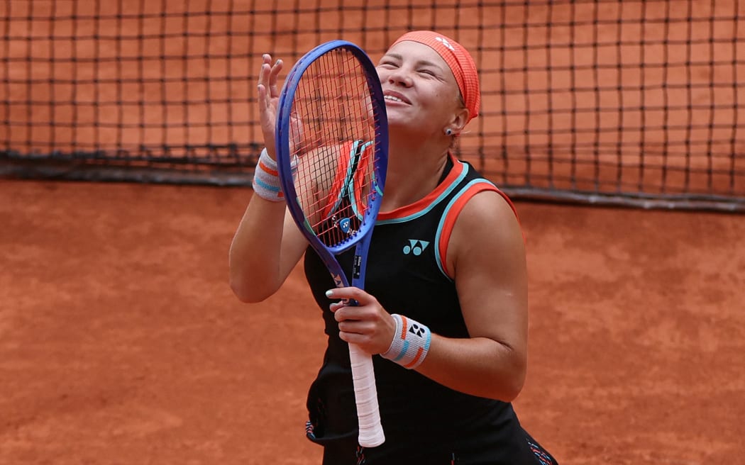 Diana Shnaider celebrates her victory at the end of her women's quarter final singles match against Aryna Sabalenka on day 11 of the French Open tennis tournament on Court Philippe-Chatrier at the Roland-Garros Complex in Paris on June 3, 2026. (Photo by Alain JOCARD / AFP)
