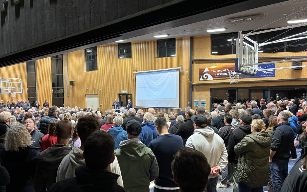 A packed public meeting at the Pegasus Bay School opposing the purchase of Pegasus' 18 hole championship golf course by housing developer Wolfbrook.