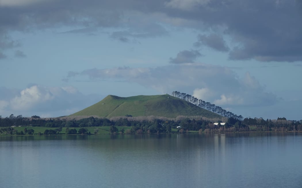 The maunga Te Ahuahu is reflected in Lake Ōmāpere.