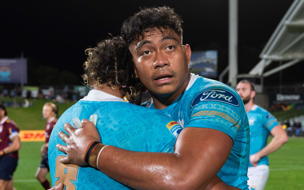 Moana Pasifika captain Miracle Fai'ilagi with Semisi Tupou Ta'eiloa after their loss to the Reds.