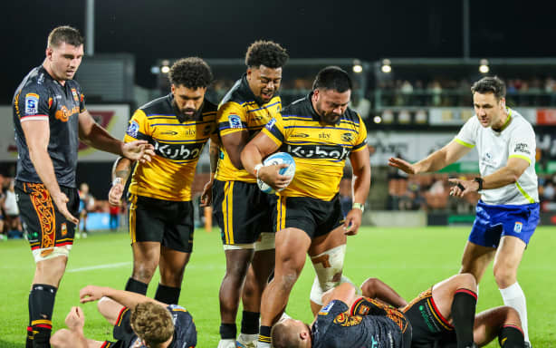 Hurricanes celebrate a try against the Chiefs.