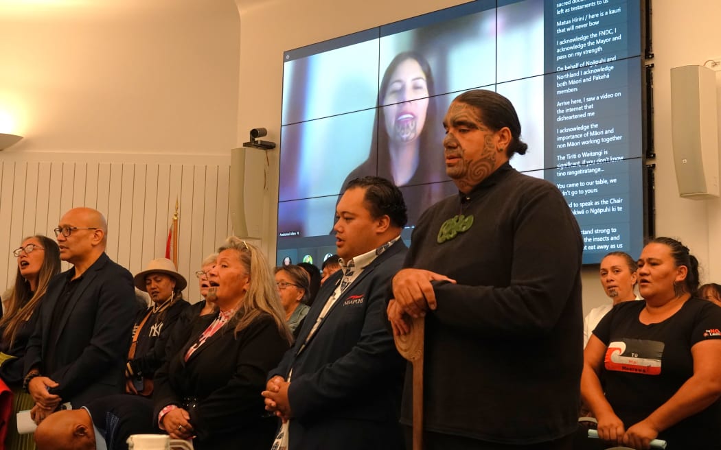 Speakers and members of the public sing a waiata tautoko.