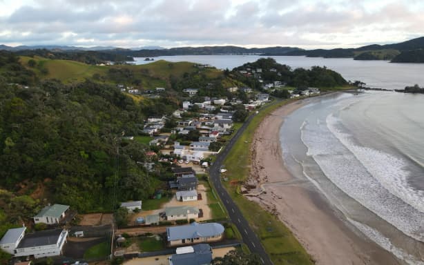 Floodwaters at Ōakura Bay as seen from the air.
