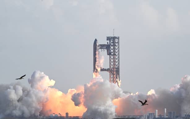 SpaceX's Starship rocket lifts off from Starbase, Texas, as seen from South Padre Island on August 26, 2025, for its tenth test flight. SpaceX's Starship megarocket roared into the skies Tuesday on its 10th test flight, following a string of explosive failures that cast doubt about its ability to realize Elon Musk's vision of colonizing Mars. (Photo by RONALDO SCHEMIDT / AFP)