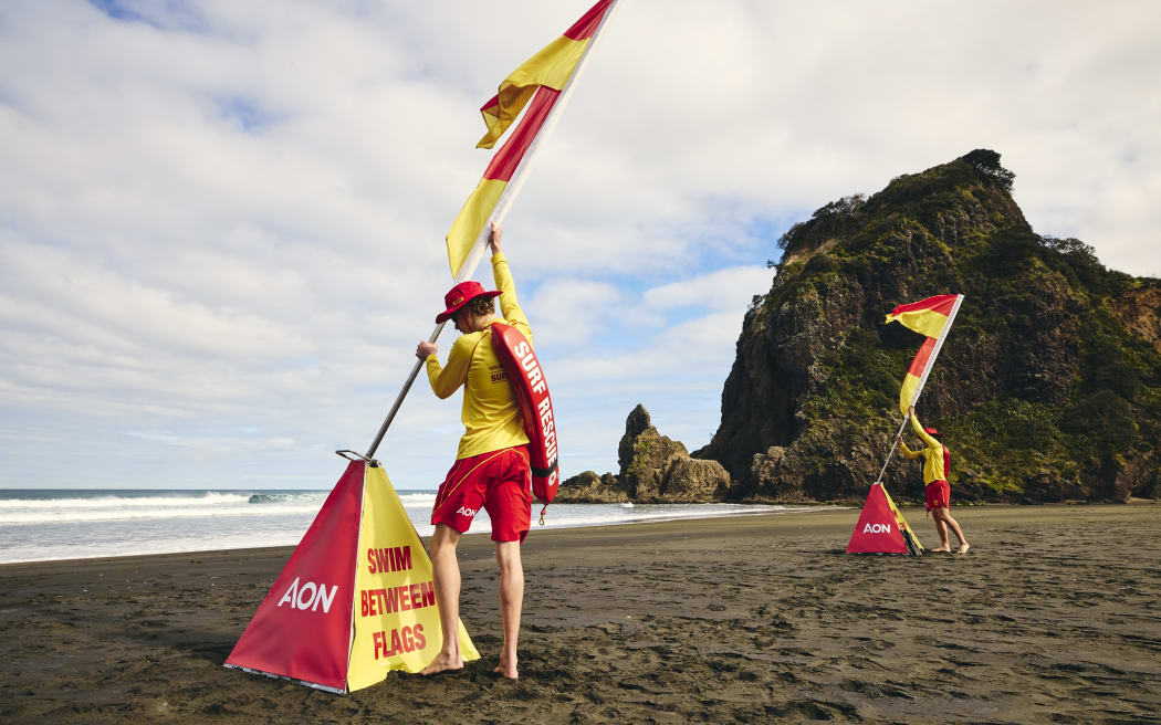 Surf life savers at Piha Beach, west of Auckland City, which is considered one of New Zealand's most dangerous beaches.