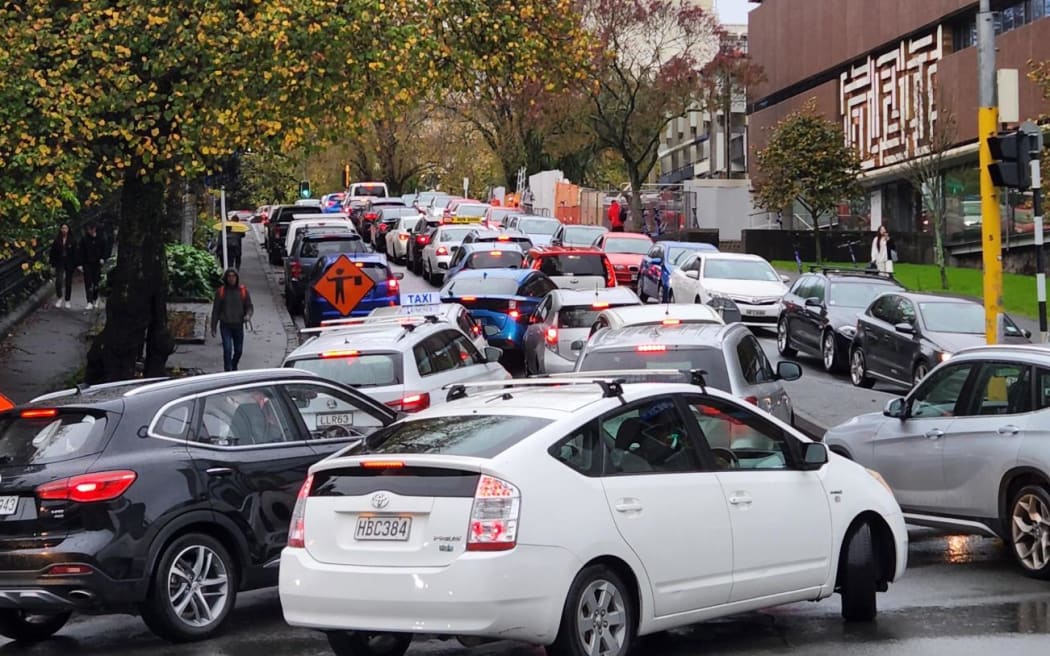 A traffic choked Princes Street in Auckland CBD on 9 May 2023 as heavy rain causes flooding and cancels some public transport.