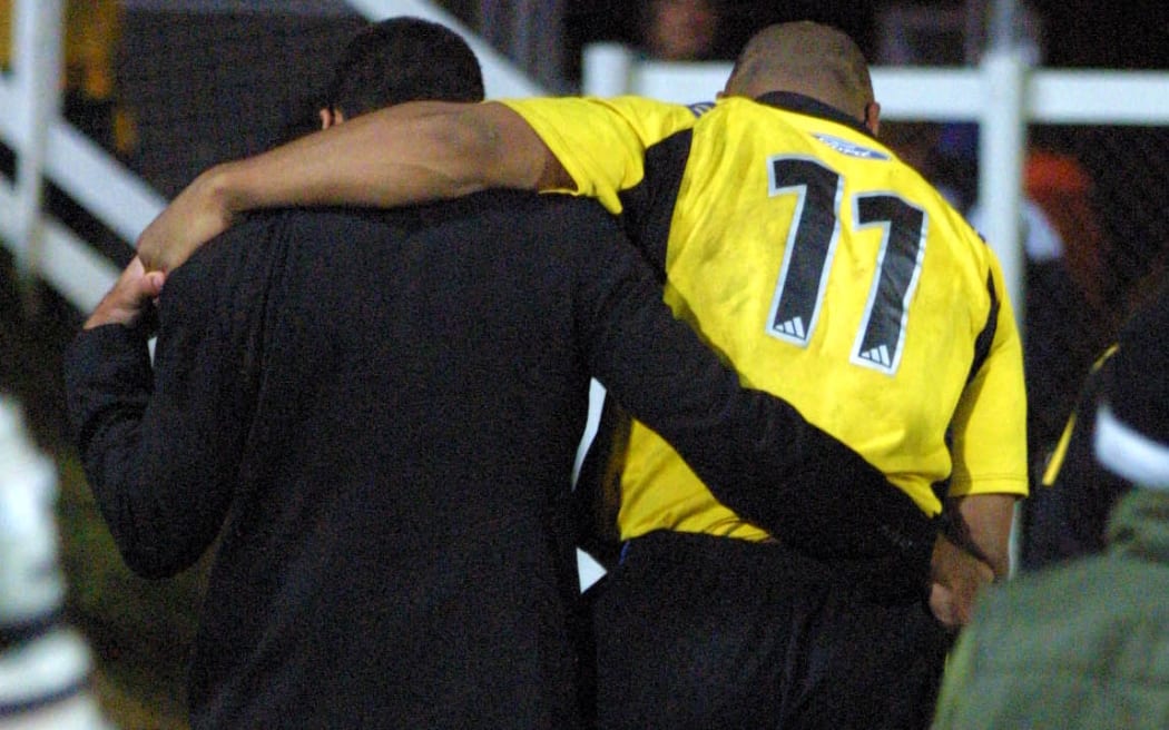 Jonah Lomu walks off with an injured foot during the rugby union Super 12 match between the Hurricanes and Waratahs.