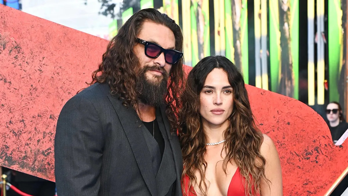 Jason Momoa is loved up with girlfriend Adria Arjona at Supergirl event
