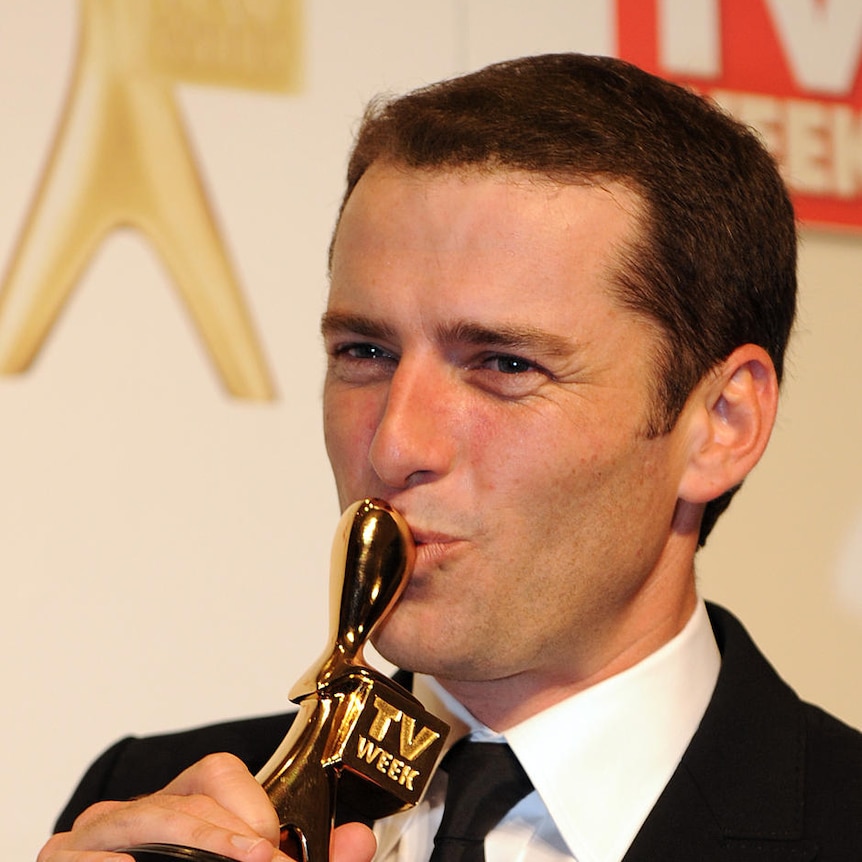 Karl Stefanovic from the Channel 9's Today Show kisses his Gold Logie