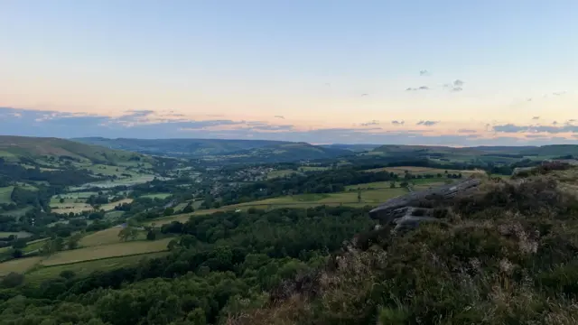A view over the hills at sunrise.