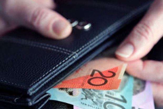 Person sorting through bank notes, cash in wallet, Australian currency