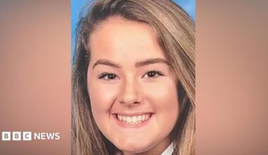 Emily Moore smiles at the camera in a school picture. She has brown eyes and long light brown hair.