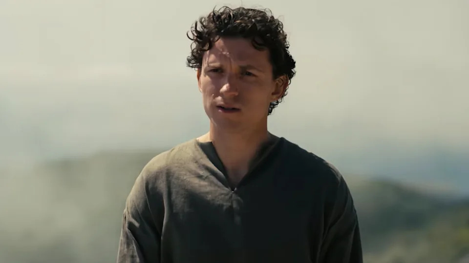 Tom Holland standing in The Odyssey