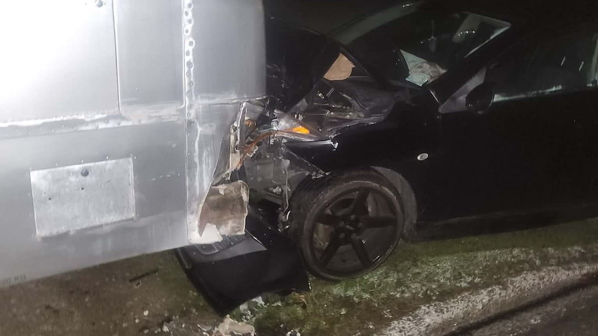 Driver seriously injured after car slams into parked bus on Ford Rd