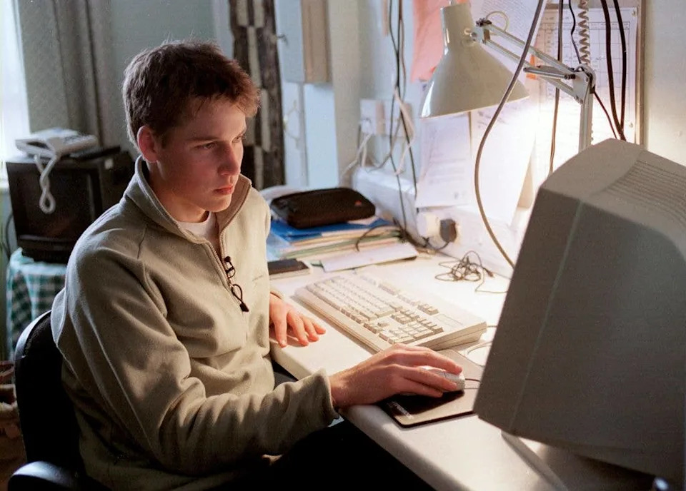 Prince William using a computer at Eton College