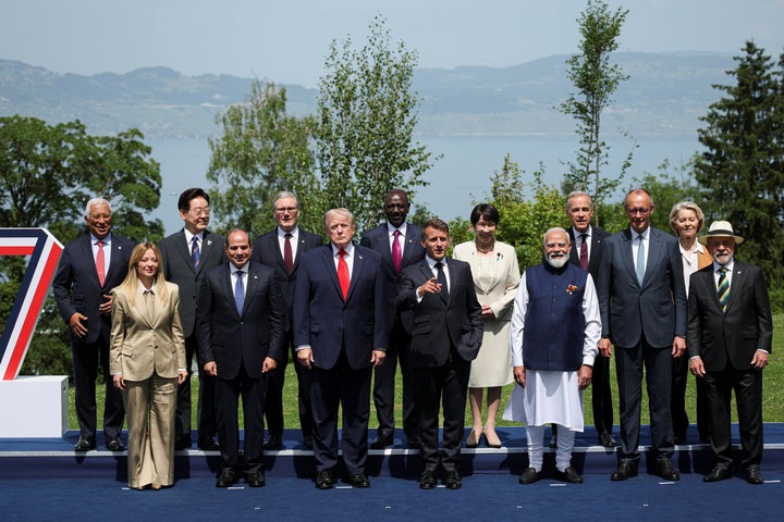 President Donald Trump and other world leaders pose during the G7 summit Tuesday in France.