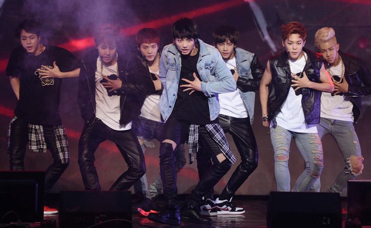 K-pop boy band BTS, signed to the then relatively small agency BigHit Music, performs during a media showcase marking the release of its debut full-length album, 'Dark & Wild,' at Blue Square in Yongsan District, Seoul, August 2014. Newsis