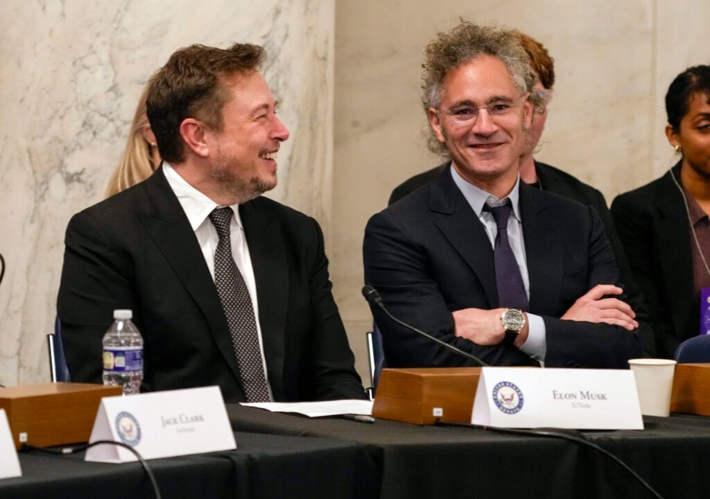 Palantir CEO Alex Karp Is 'Rooting For Elon'—And Has Clients 'Screaming' About OpenAI, Anthropic