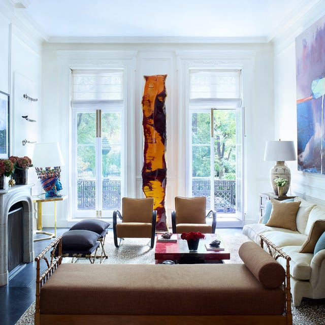 Elegant living room with modern art and classic furniture.