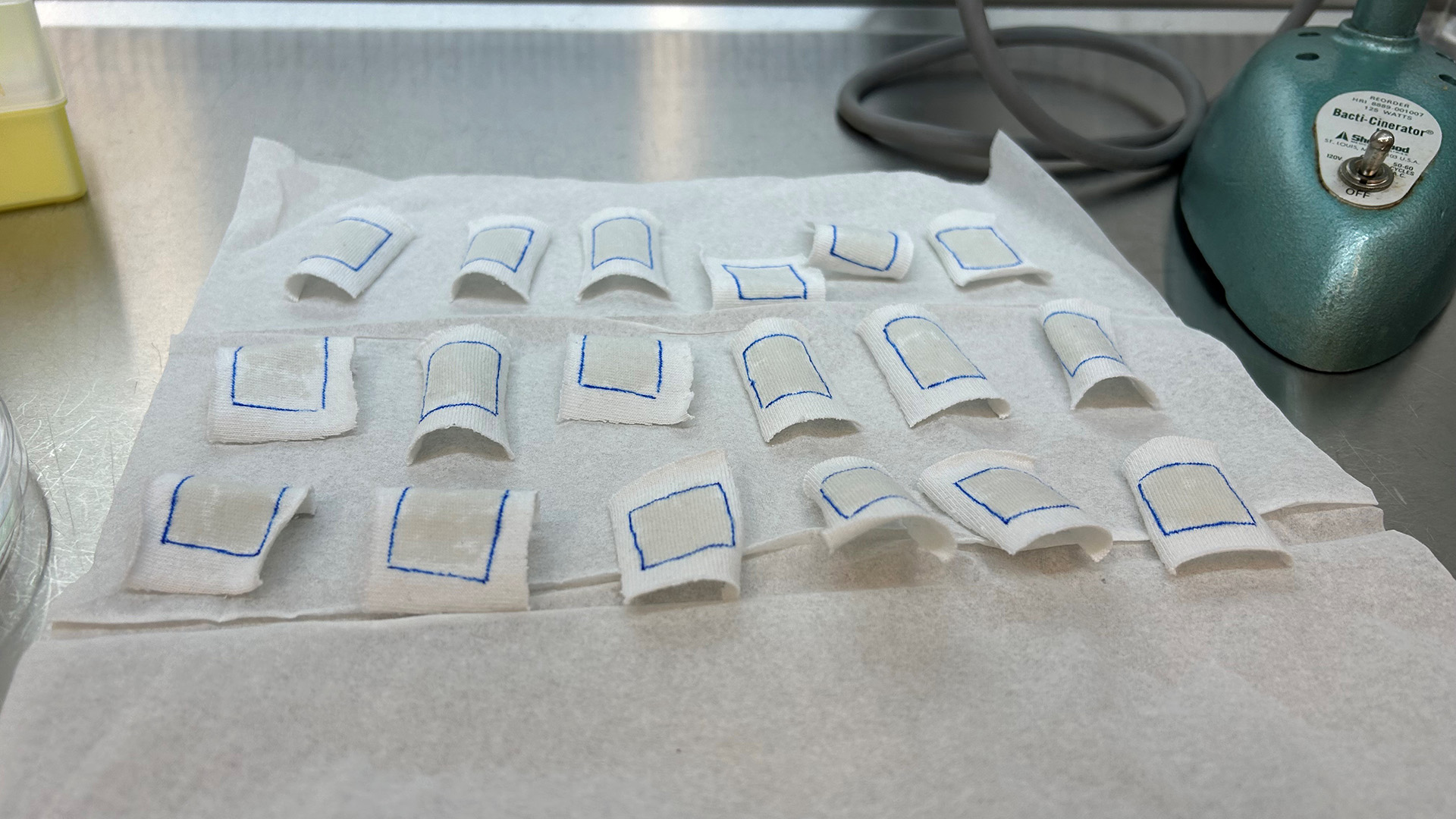 A close up of a series of white squares on a table.
