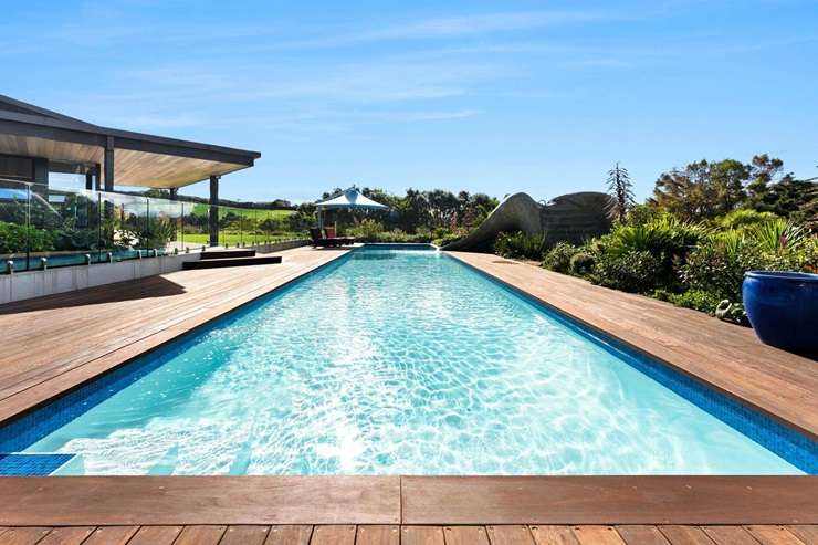 The three-bedroom rammed-earth home at 97 Sharp Road, in Matakana, is known locally as Obsidian House. Photo / Supplied