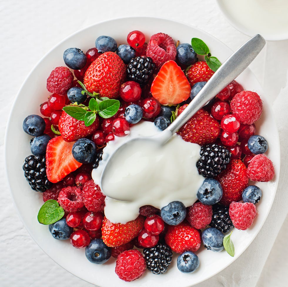 bowl of healthy fresh berry fruits and yoghurt