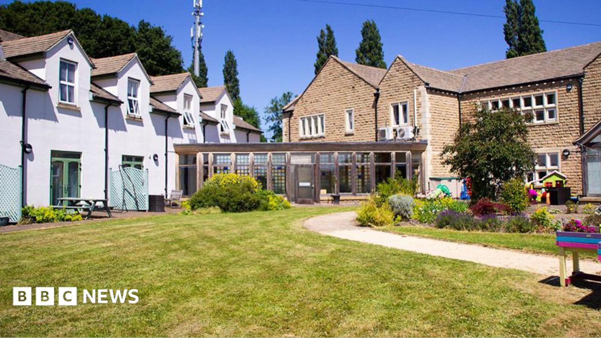 Exterior image of a hospice building set in landscaped gardens.