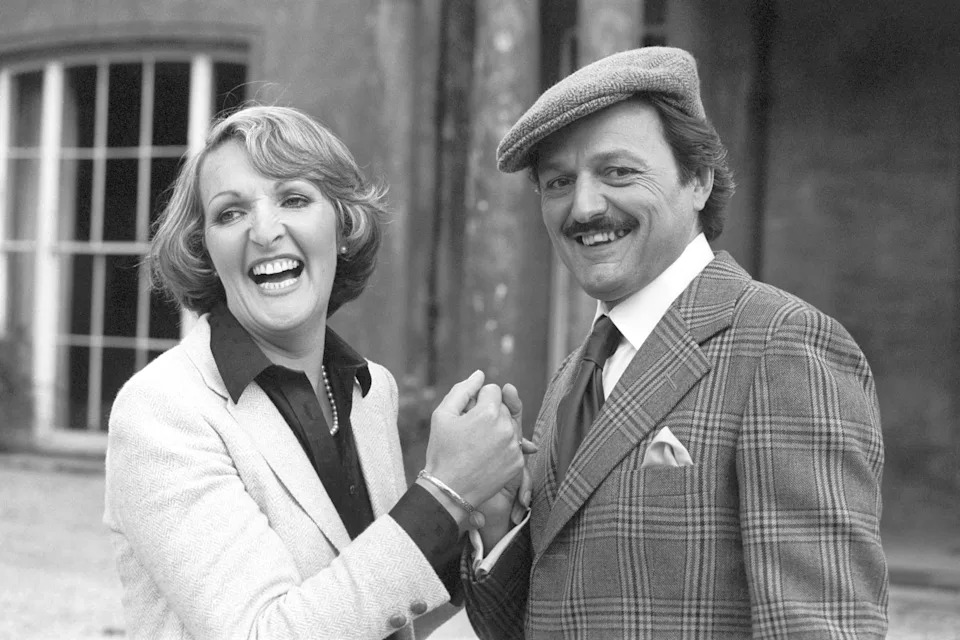 Actress Penelope Keith, left, as Audrey fforbes-Hamilton, with Peter Bowles who plays her wealthy would be suitor, Richard DeVere in their popular TV series, 'To The Manor Born', on location at Cricket House, Cricket St Thomas, Somerset. (Photo by PA Images via Getty Images)