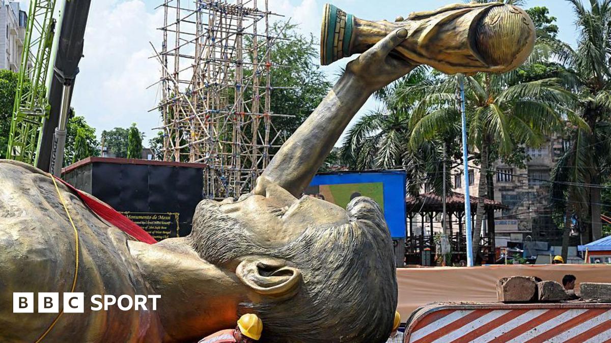 Lionel Messi's 70ft statue laid horizontally being transported.