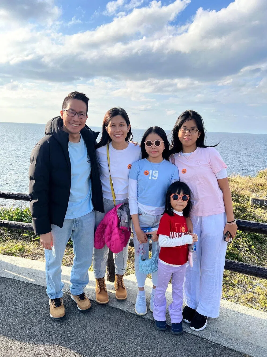 Financial planner Lee Meng with her husband and their three daughters, aged 16, 14 and seven.