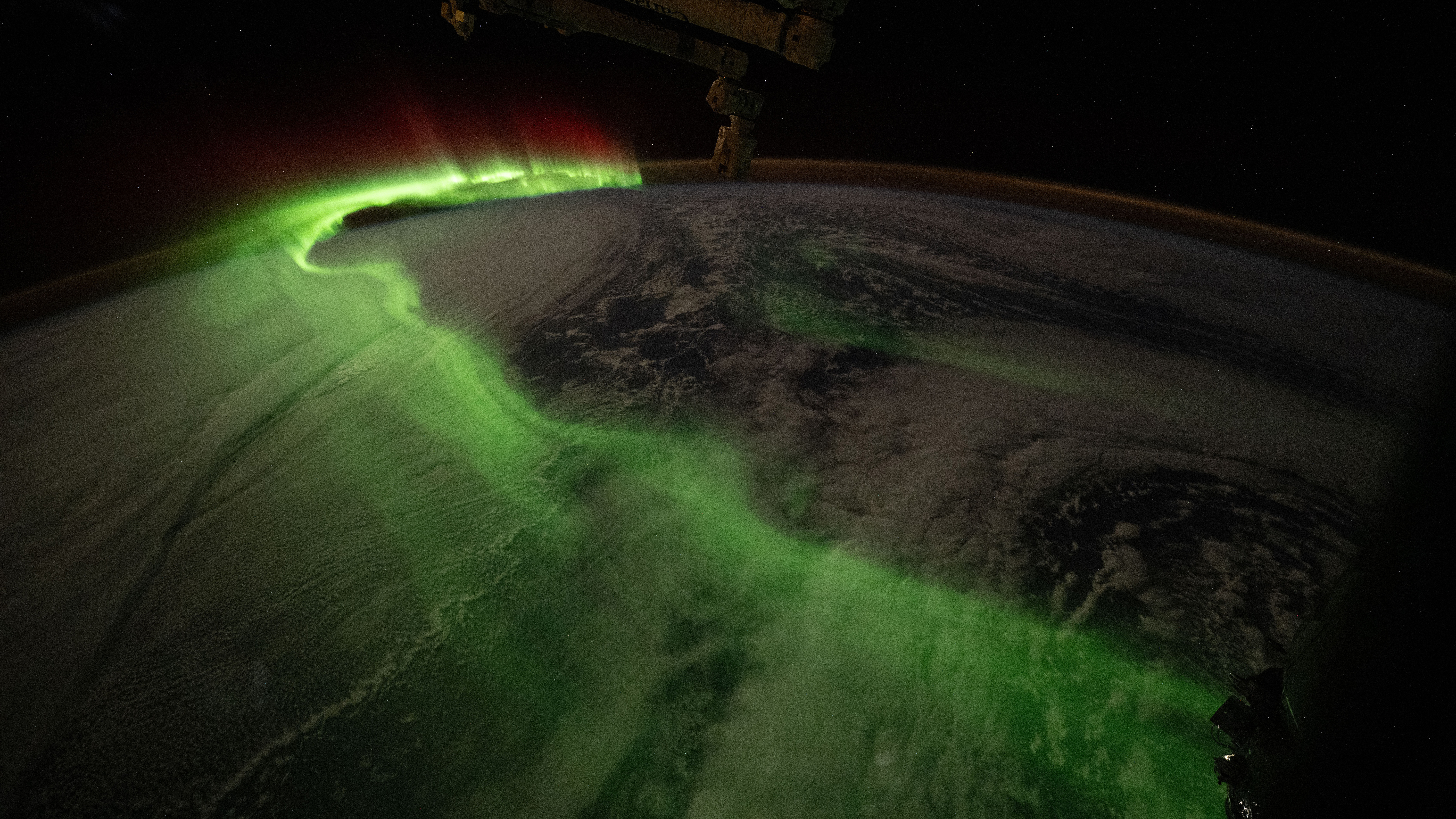 iss074e0672727 (June 5, 2026) ---The aurora australis arcs over Earth during an active solar event in this photograph taken at approximately 11:32 p.m. local time from the International Space Station as it orbited 271 miles above the Indian Ocean southwest of Perth, Australia. Credit: NASA/Jessica Meir