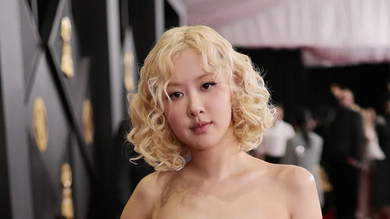 Rosé poses with short, curly hair