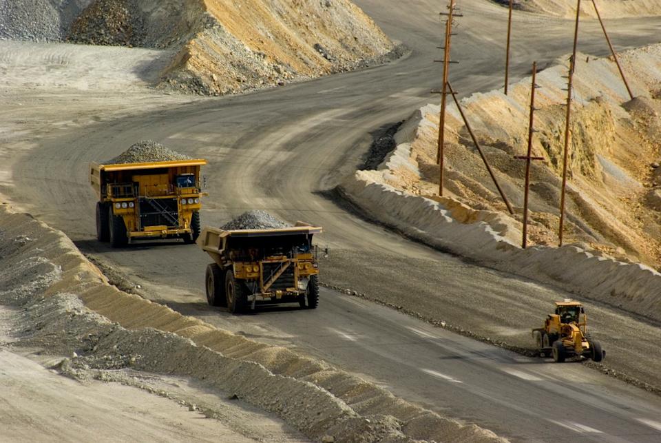 Trucks full of ore at a giant mine.