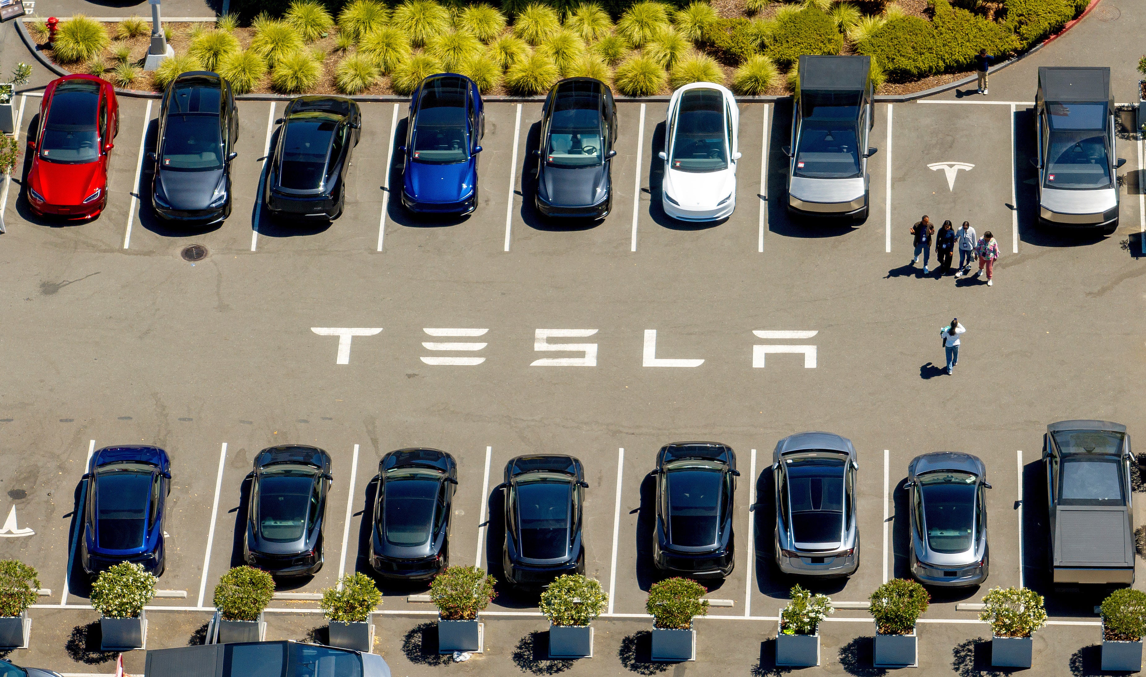 Tesla has struggled with rising competition in the EV space. Last year, the company lost its crown as the world’s largest EV maker to China’s BYD (AP Photo/Noah Berger)