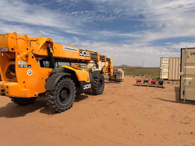 A fork lift works at a job site.