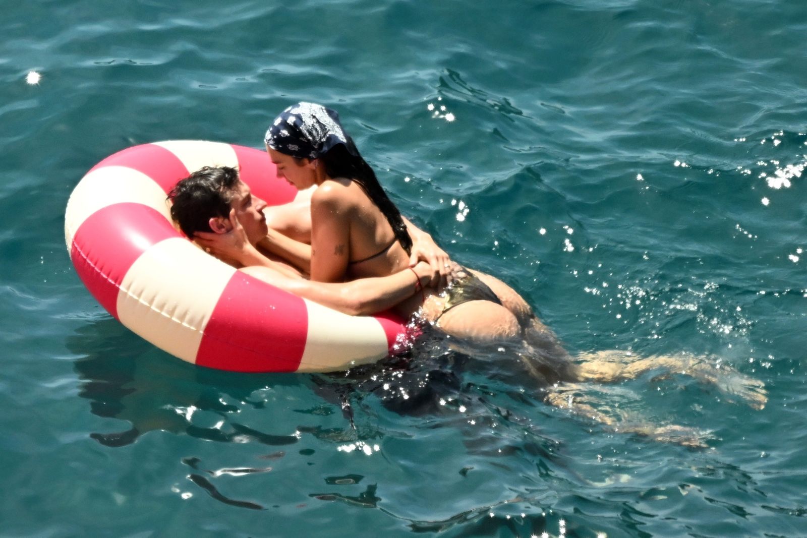 Image may contain Callum Turner Dua Lipa Clothing Swimwear Leisure Activities Person Sport Swimming and Water