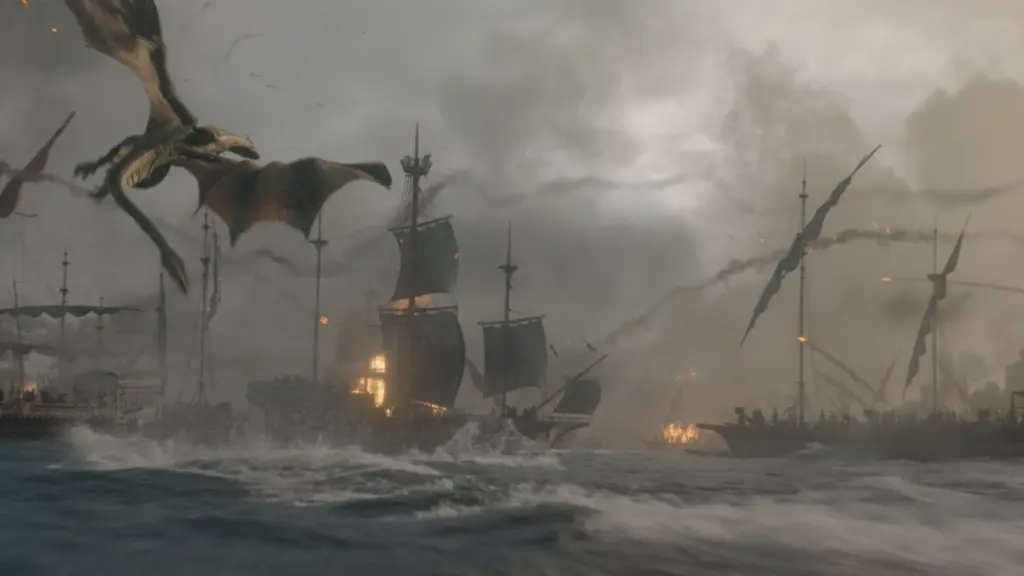A dragon flies over a bunch of naval ships firing at each other at sea during the Battle of the Gullet in HOUSE OF THE DRAGON Season 3 on HBO. 