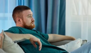 Bored Lazy Man Sitting on Couch