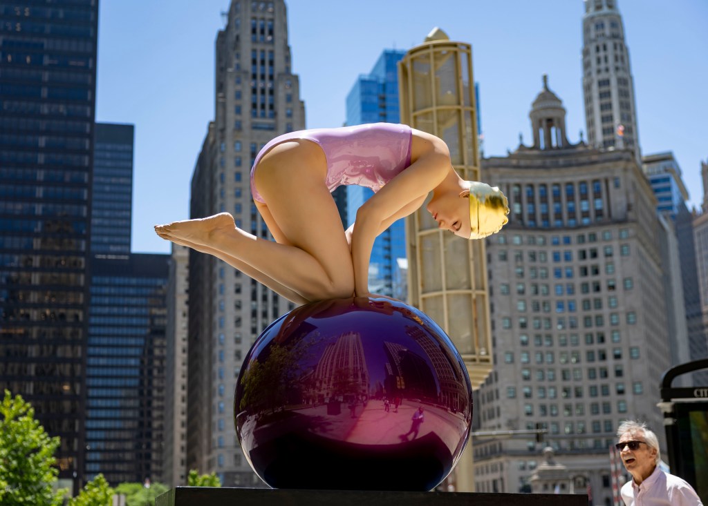 Swimmer sculptures arrive on Michigan Avenue for the summer