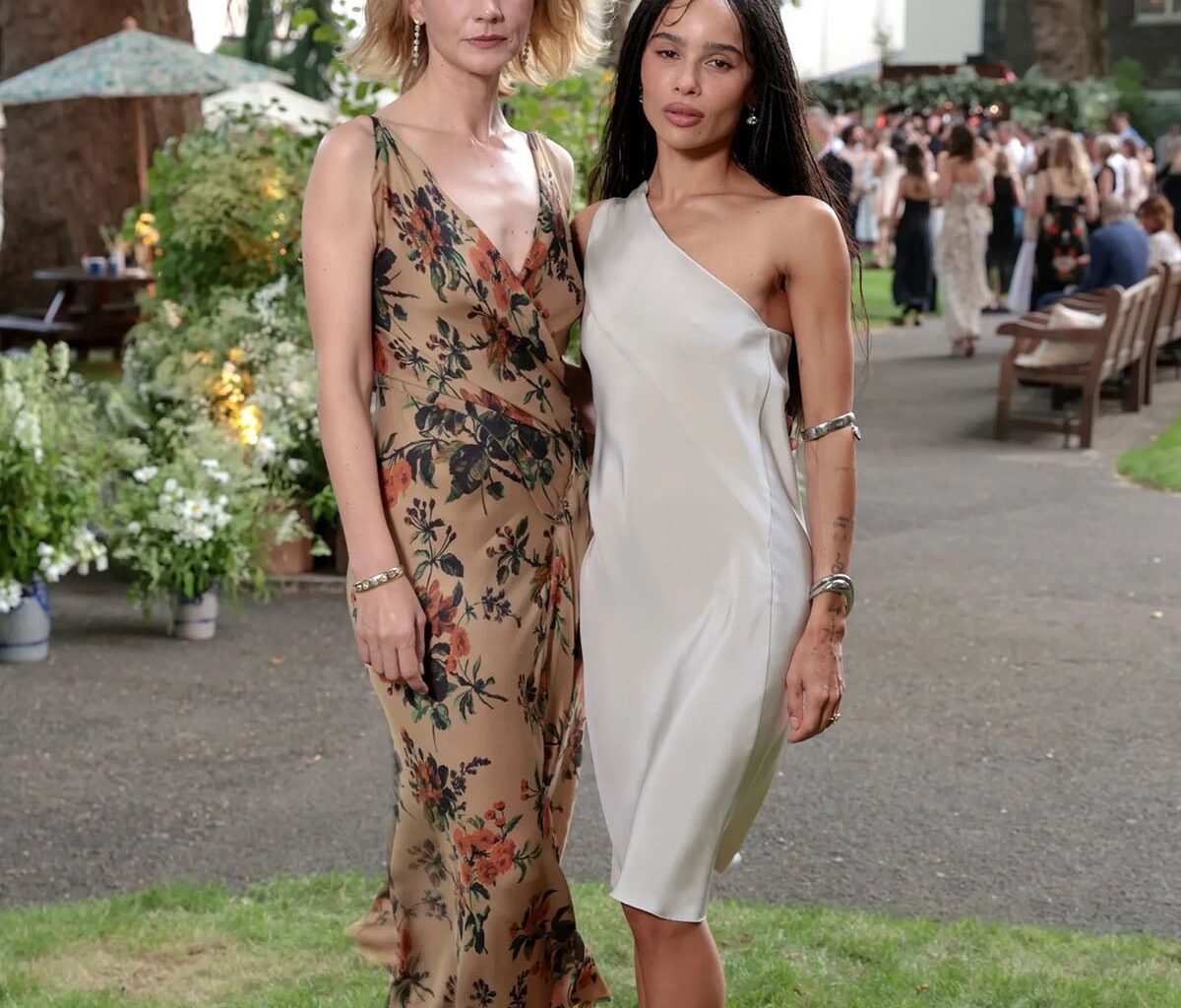 Carey Mulligan wears a Donna Karan floral dress with Zoë Kravitz in a silver silk dress at the Jessica McCormack Summer Solstice Party in London.