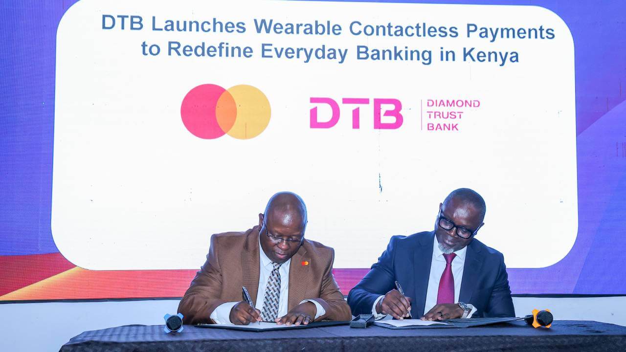 Victor Ndlovu from Mastercard and George Otiende from Diamond Trust Bank sign an MoU at Gitex Kenya 2026. 