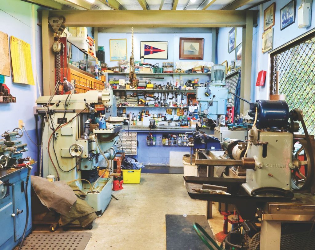 Ron Copeland’s snug engineering workshop located beneath the bridge servicing his house. // Photo credit: John Macfarlane / Boating New Zealand