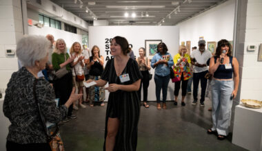GFAA Executive Director Katy Lemle (center) presenting Jane Polkowski (left) an award for her artwork Self Portrait with Toulouse being selected as Best in Show.