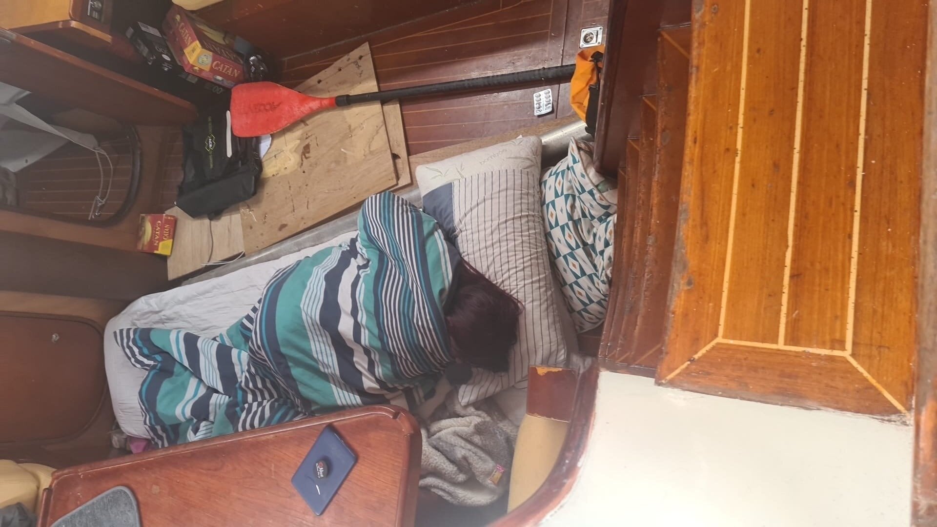  Shifrah Dawson sleeping on the saloon floor of the yacht Cahuna.